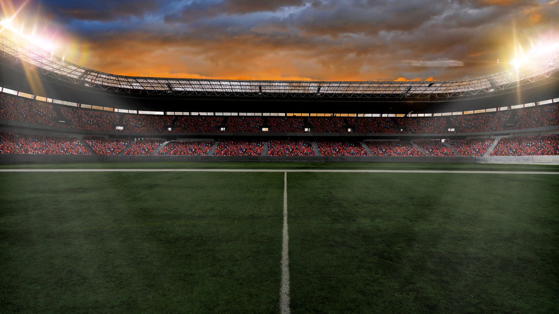 Estadio de fútbol vacío bajo un cielo despejado y brillante,